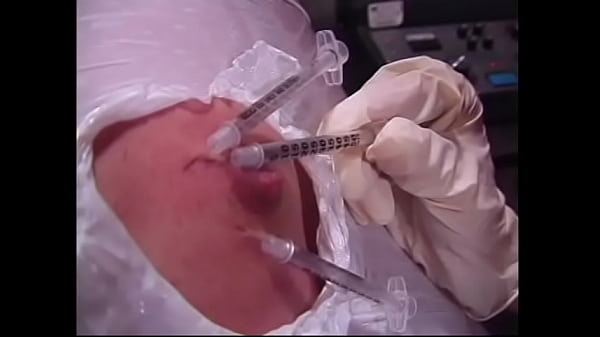 A naughty brunette and a busty redhead bitches wrapped a guy’s body with a film and injected him with syringes