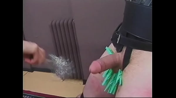 Mature dominatrix Mistress Scarlett pours hot wax on dude’s balls and cock