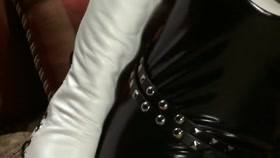 Armbinder and black catsuit with wand torture