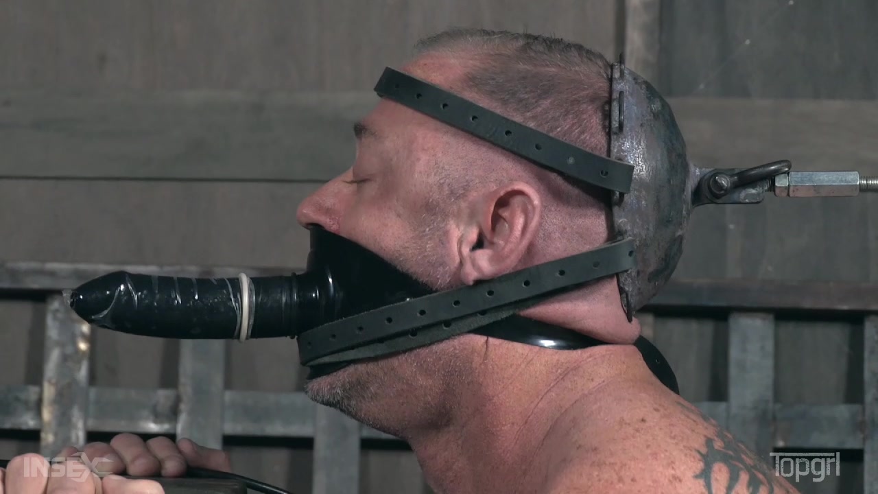 TopGrl – Ultimate Domina in pink dress canes her muscled slave in the dungeon